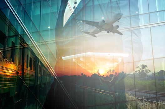 Double Exposure of BusinessMan Hold Tablet and Train, Airplane as Business Transportation, Business Travel or Logistics Concept. 