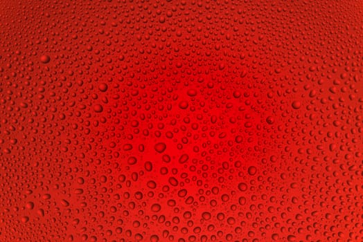 Background from drops of water of the different size on red glass