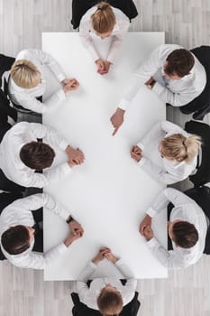 Diverse business people sitting around the table on a meeting