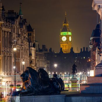 Elizabeth Tower also known as the Clock Tower seen from Trafalgar Square at night in London, England, UK