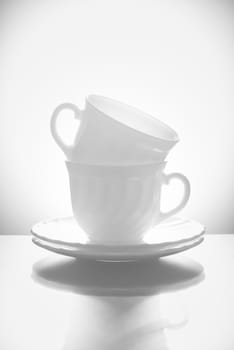 Cups for tea with saucers on a white background