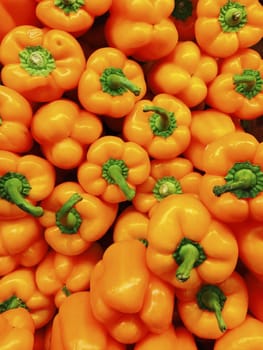 Orange Peppers in a stall or shop.