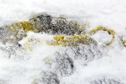 A winter landscape showing yellow snow on a winter day