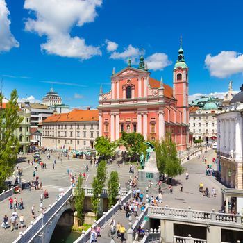 Romantic Ljubljana city center. River Ljubljanica, Triple Bridge - Tromostovje, Preseren square and Franciscan Church of the Annunciation. Ljubljana Slovenia Europe.