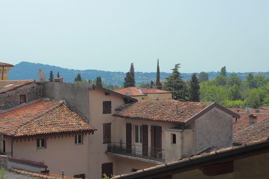 Scenic view over small italian village and hill side