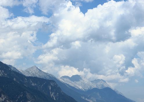 View over mountain range with black clouds