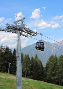 Ski gondol to the mountain top in the summer