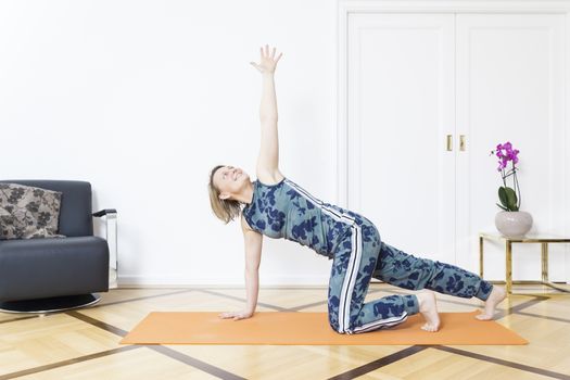 An image of a woman doing yoga at home