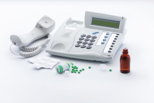 Offhook telephone set and medicines in tablets and drops