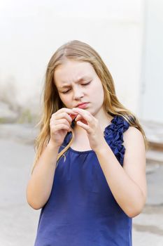 Portrait of cute girl looking to the hands