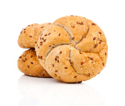 Kaiser roll with sesame seeds, on a white background