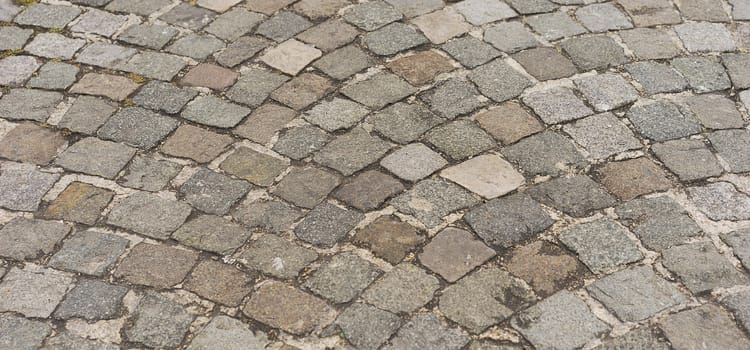 Panorama old  traditional european style cobblestone road texture background with granite blocks, stones and brickwork pattern