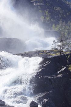 View on Langfossen Langfoss waterfall in summer, Etne, Norway