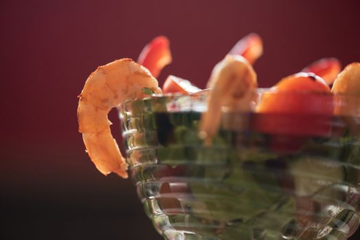 healthy green salad with cooked shrimp and vegetables