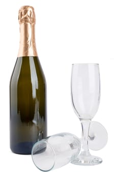 Champagne bottle and two champagne glasses isolated on white background