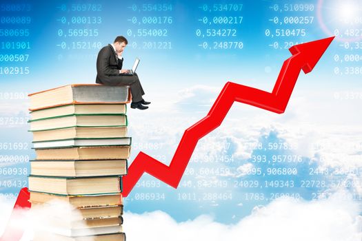 Businessman with laptop sitting on pile of books in sky with chart