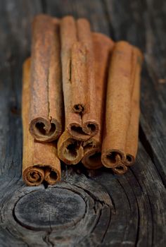 Bunch of cinnamon sticks on wooden table