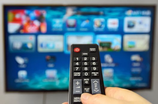 Smart tv and hand hold the remote control