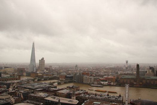 Dark sky and rain over wet London panorama view