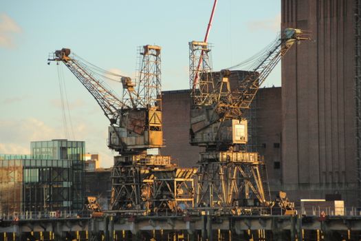 Old coal cranes at power plant near river