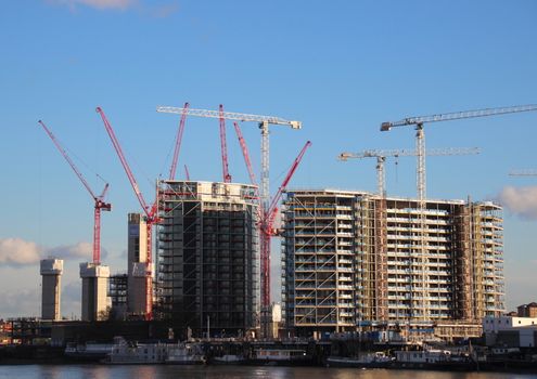 View of construction area with cranes near waterfront