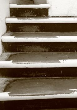 Old worn stair steps with flaked paint
