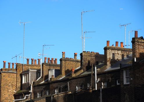 Roof top with chimneys and antennas