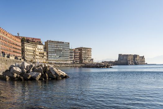 Seafront Promenade with the castle on the sea in Naples, Italy