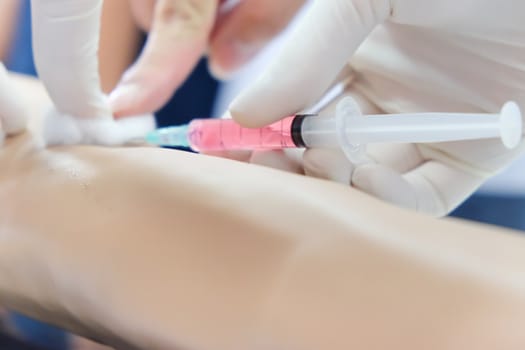 close up of Nurse makes vaccination of patient background,injection needle