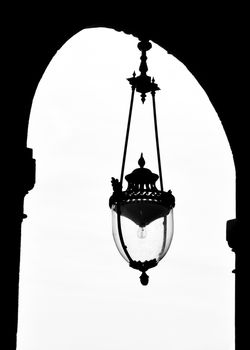 Vintage lamp at the Palais-Royal in Paris, France. Black and white photography.