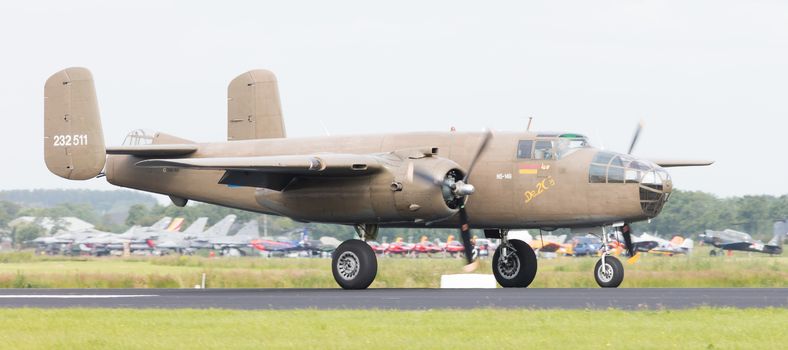 LEEUWARDEN, THE NETHERLANDS - JUNE 10: WW2 B-25 Mitchell bomber in Dutch markings take off during the Dutch Air Force Open House. June 10, 2016 in Gilze-Rijen, The Netherlands