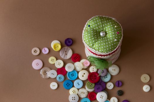 box with many pillow for needles and buttons.view from above. needlework. sewing. the photo