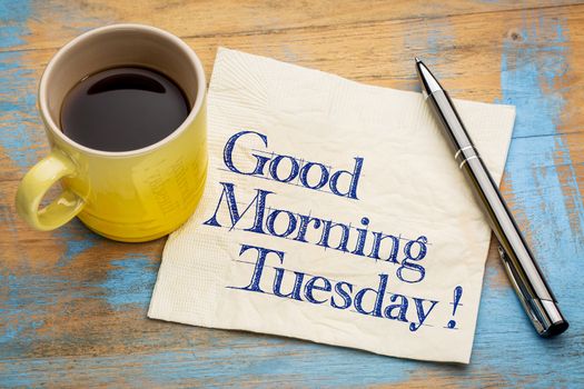 Good Morning Tuesday - handwriting on a napkin with a cup of espresso coffee