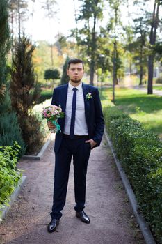 Close-up portrait of the groom with a beard