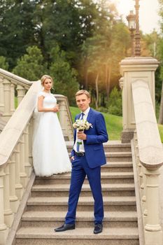 Newlyweds in the park posing for photography