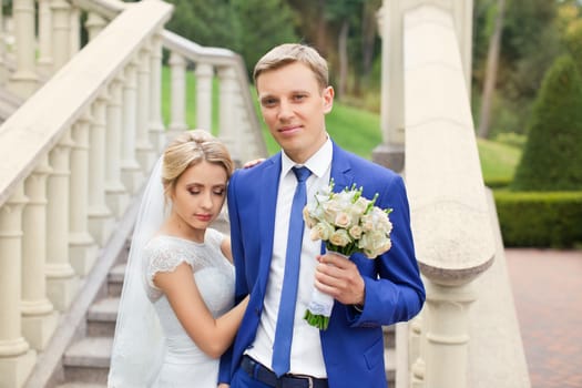 The groom gently hugged the bride