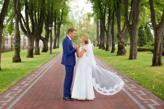 The groom gently hugged the bride