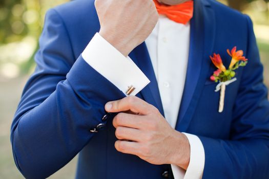 Stylish bride blue suit on a summer day
