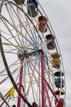 A colorful Ferris Wheel at a country fair