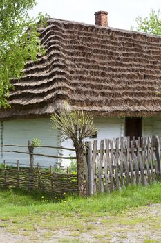 old traditional wooden polish cottage in open-air museum, Ethnographic Park, Kolbuszowa, Poland