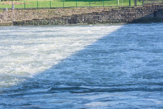 Flooded embankment in heavy rain in Essen Werden in Germany.
