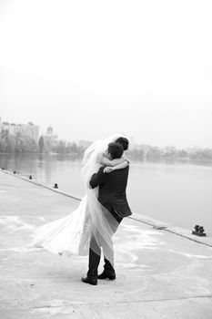 Gentle embrace bride and groom