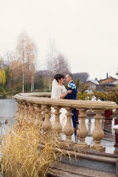 Bride and groom posing in the rain