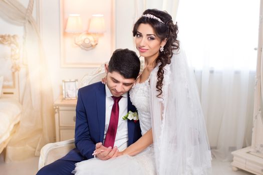 The groom gently hugged the bride on the wedding day