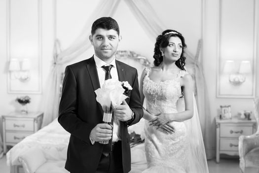 The groom gently hugged the bride on the wedding day