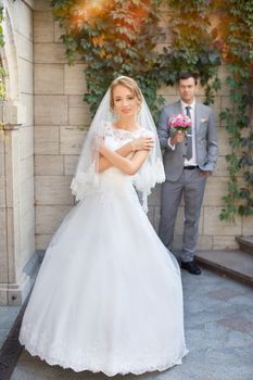 The bride and groom for a walk