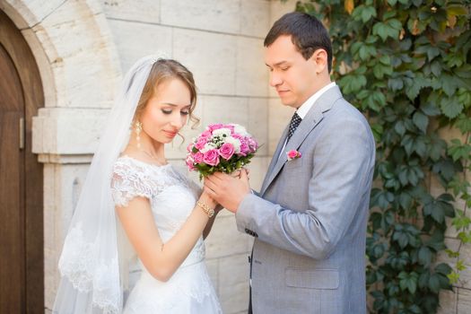 The bride and groom for a walk