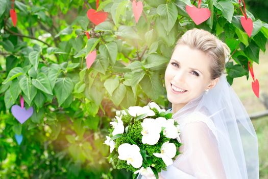 Portrait of beautiful young girl outdoors in spring