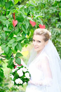 Portrait of beautiful young girl outdoors in spring