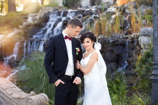 wedding copule. Beautiful bride and groom. Just merried. Close up. Happy bride and groom on their wedding hugging. 